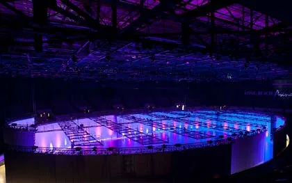 Arena lighting rig over an event floor